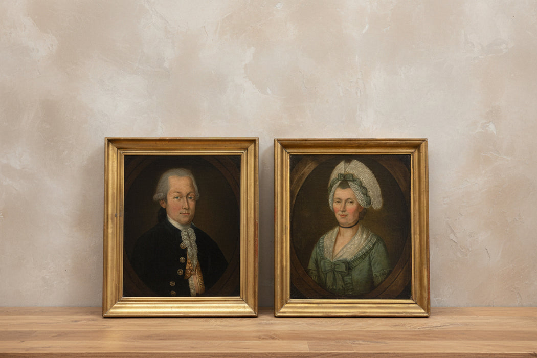 PAIR OF 18TH CENTURY GOLD FLARED FRAMED PORTRAITS OF MAN AND WOMAN IN GREEN