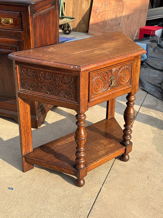 CANTED OAK LUNETTE AND VOLUTE CARVED CONSOLE