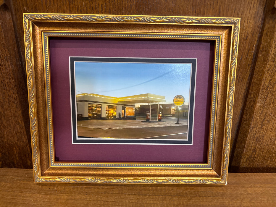 GOLD FRAMED PICTURE OF GAS STATION
