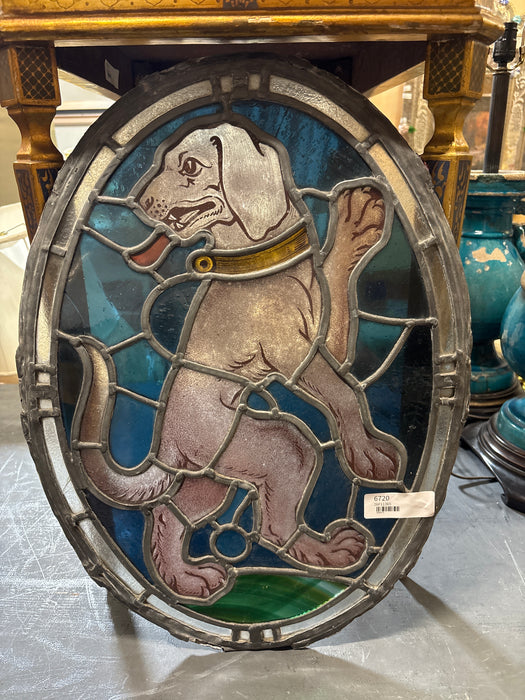 SMALL UNFRAMED OVAL STAINED AND PAINTED GLASS DOG WINDOW