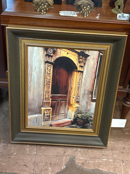 BLACK AND GOLD FRAMED PAINTING OF FANCY DOOR WAY