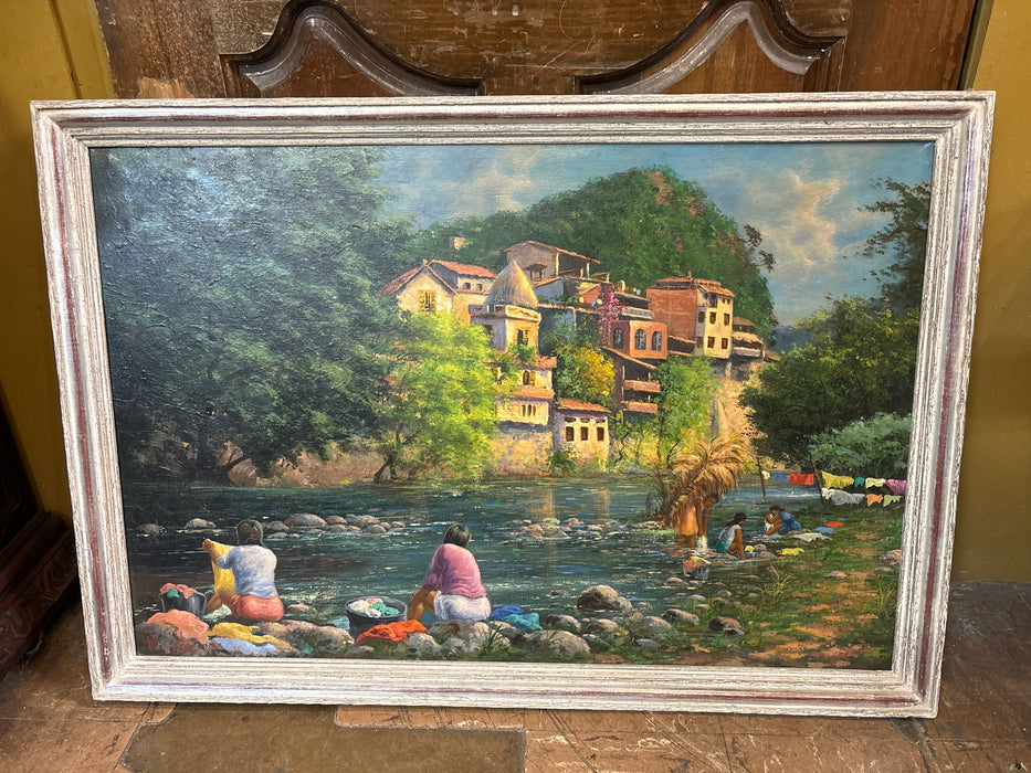 LARGE FRAMED PAINTING OF WOMEN WASHING CLOTHES IN A MOUNTAIN STREAM