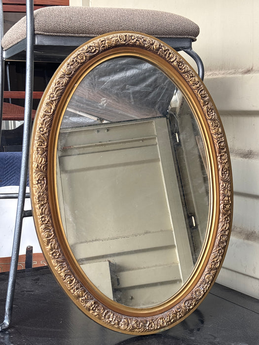 GILT FLORAL PLASTIQUE FRAMED OVAL MIRROR
