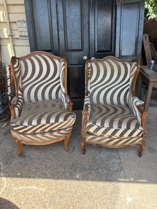 MISMATCHED PAIR OF SWIRLY ZEBRA UPHOLSTERED WING BACK CHAIRS