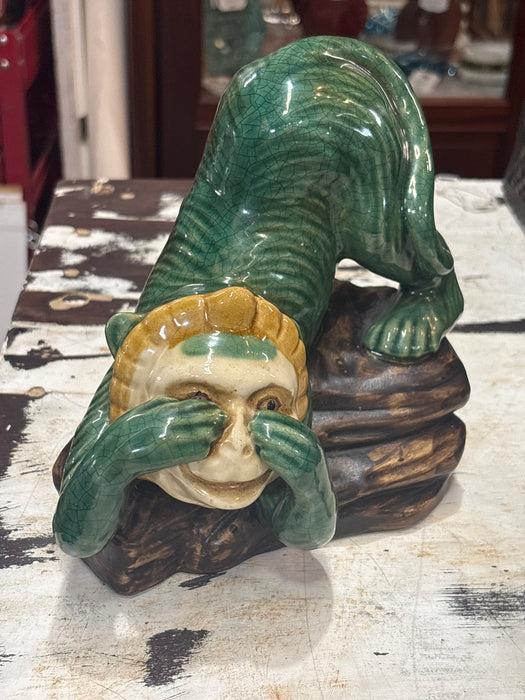 PEEKING GREEN GLAZED POTTERY MONKEY ON LOG