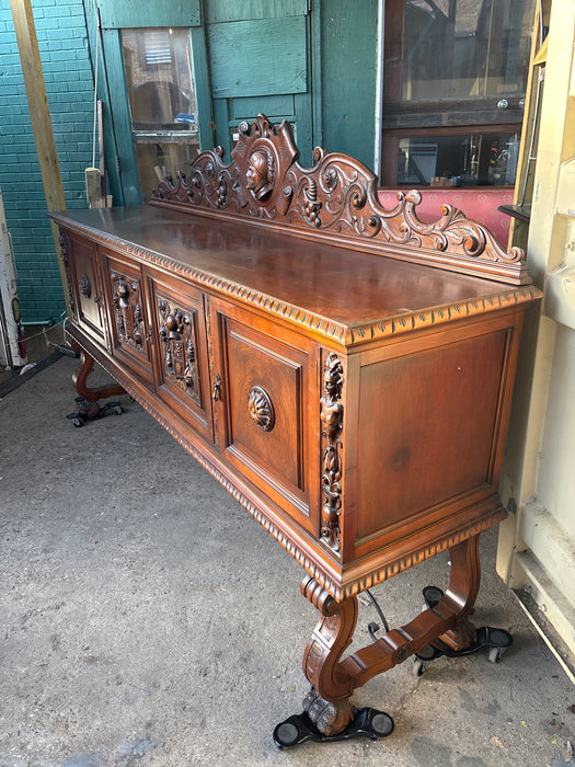 LARGE SPANISH PAW FOOT WALNUT SIDE BOARD WITH KNIGHTS