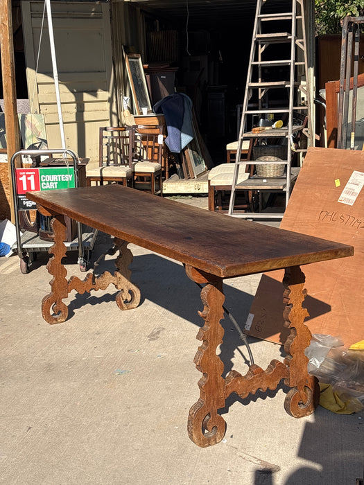 18TH CENTURY SPANISH BAROQUE TABLE WITH IRON STRETCHERS AND SINGLE BOARD TOP