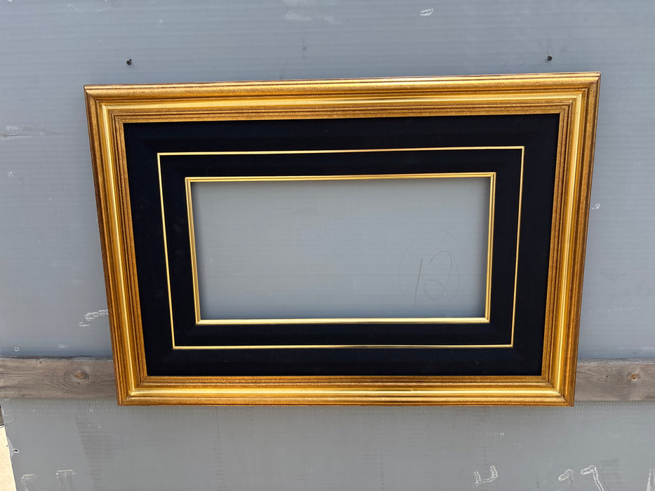 LARGE GILT FRAME WITH DOUBLE BLACK MATTE