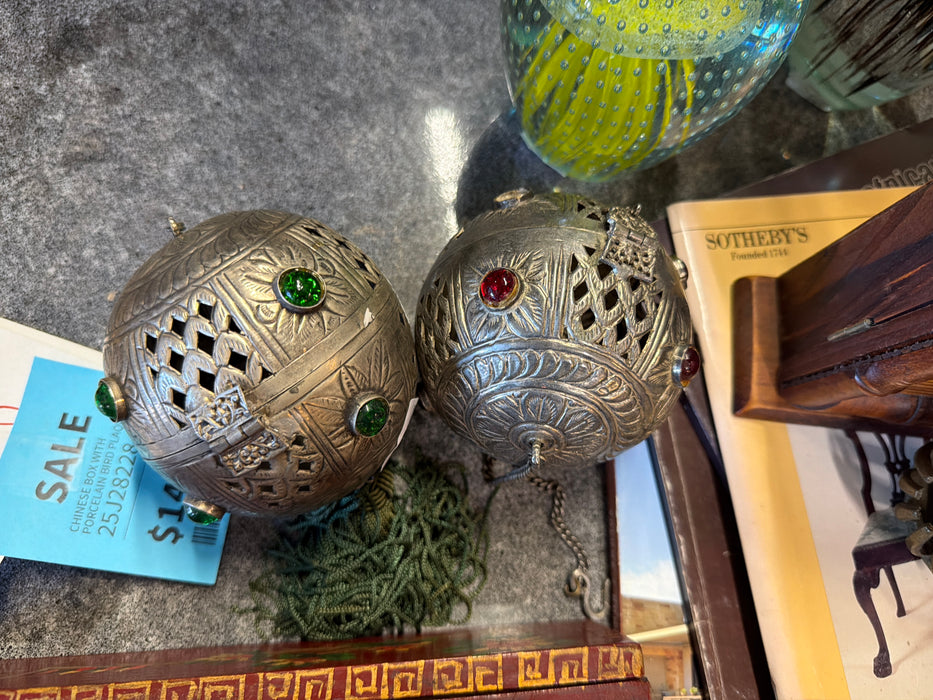 PAIR OF PIERCED METAL SPHERES
