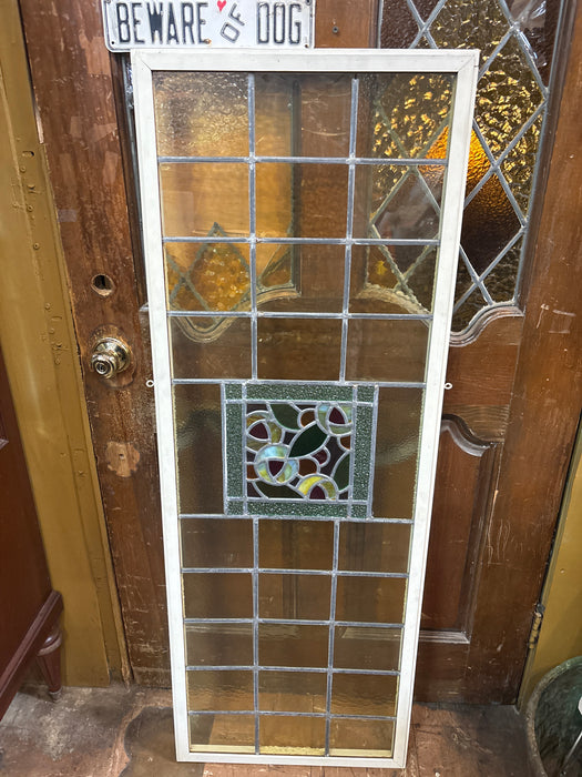 LARGE GREEN STAINED GLASS WINDOW WITH FLORAL CENTER AND THIN WHITE FRAME
