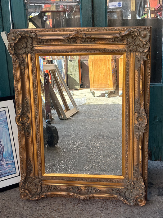 LARGE ORNATE GILT COMPOSITION BEVELED MIRROR