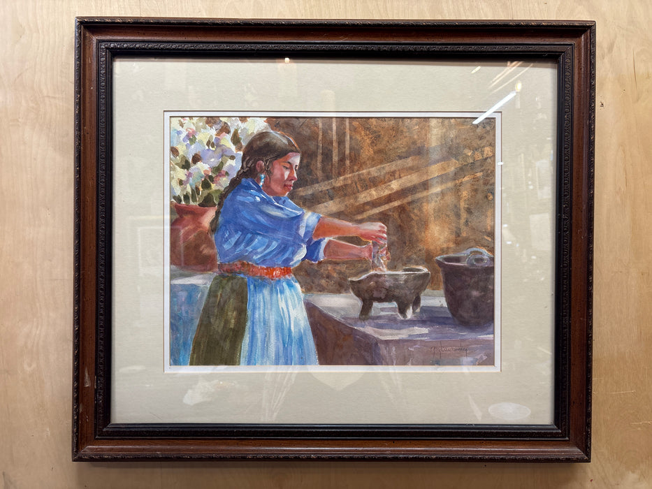 FRAMED WATERCOLOR OF WOMAN IN BLUE DRESS USING MORTAR AND PESTLE - SIGNED
