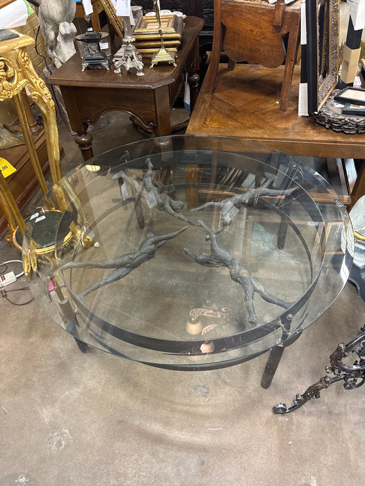 ROUND BRONZE FINISH ERNEST TROVA FIGURAL IRON COFFEE TABLE WITH GLASS TOP