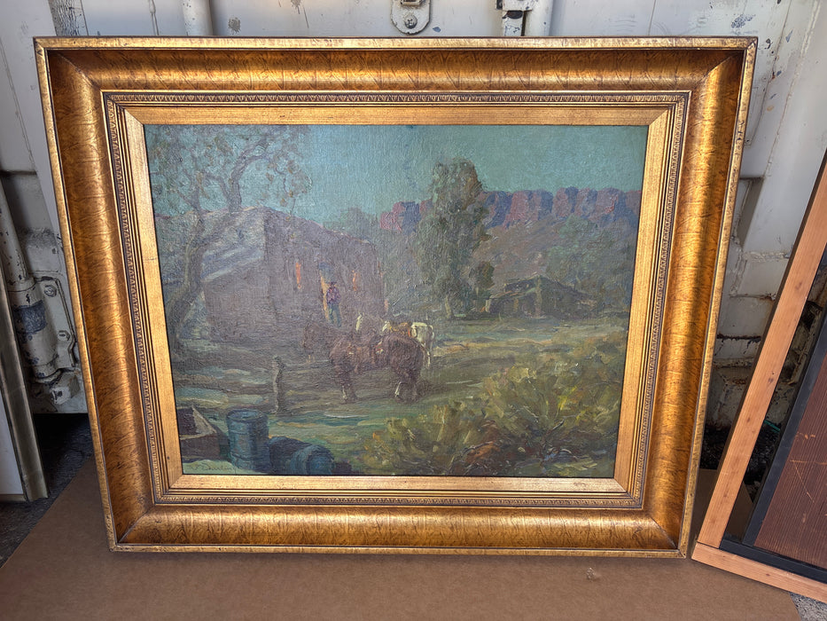 LARGE GILT FRAMED OIL PAINTING OF HORSES AND MAN IN ADOBE HOUSE - SIGNED W. DARLING