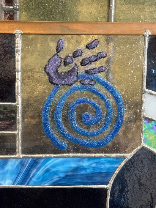 SMALL BLUE AND PURPLE STAINED GLASS WINDOW WITH HAND