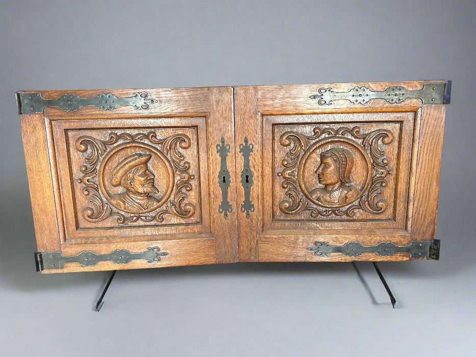 PAIR OF PORTRAIT CARVED DOORS WITH IRON STRAP HINGES