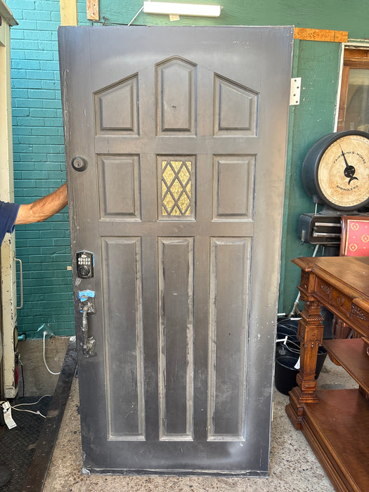 BLACK EXTERIOR DOOR WITH SMALL STAINED GLASS WINDOW