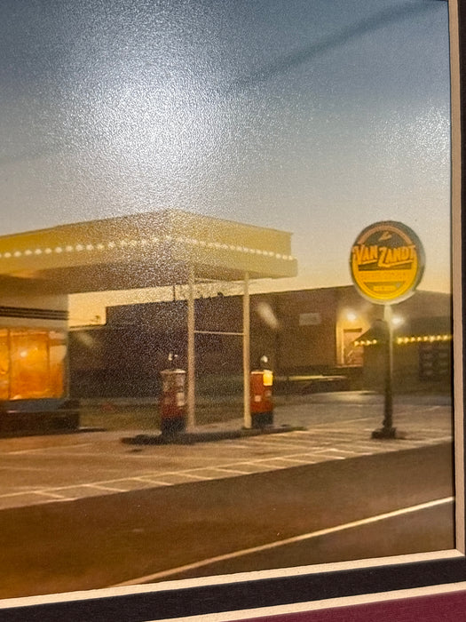 GOLD FRAMED PICTURE OF GAS STATION