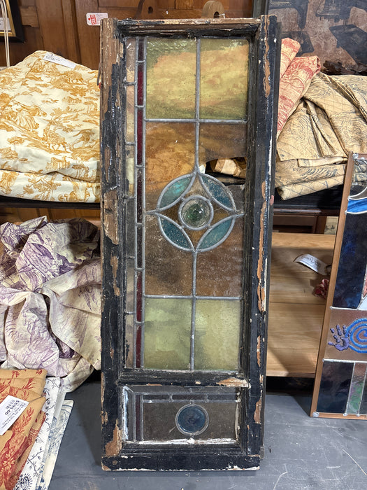 BLACK FRAMED 1800'S BLUE AND ORANGE ROSETTE STAINED GLASS WINDOW - AS FOUND
