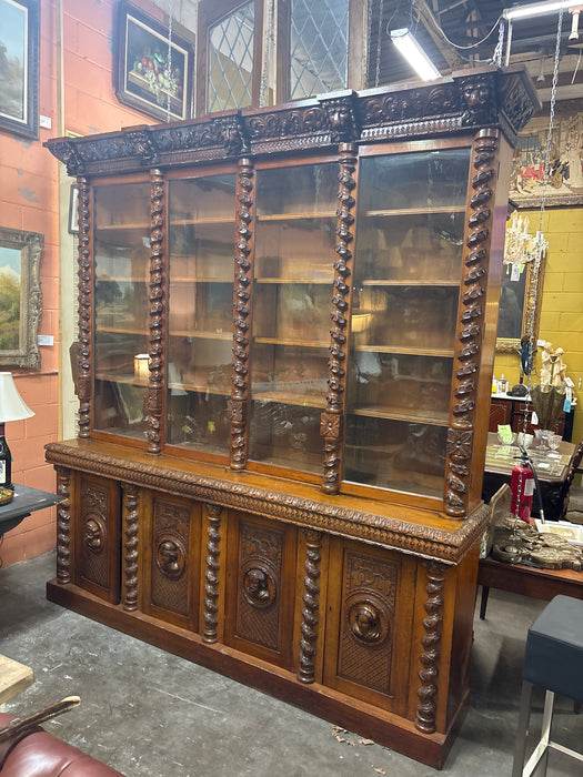 HUGE STEPBACK 4 DOOR CARVED PORTRAIT HEAD BOOKCASE WITH FOLIATE TWIST COLUMNS
