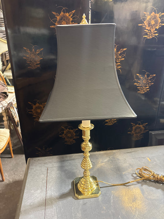 PAIR OF BRASS CANDLESTICK LAMPS WITH BLACK SHAPED SHADES
