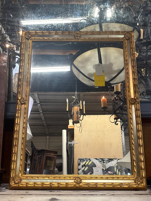 GOLD MIRROR WITH FLORAL ACCENTS
