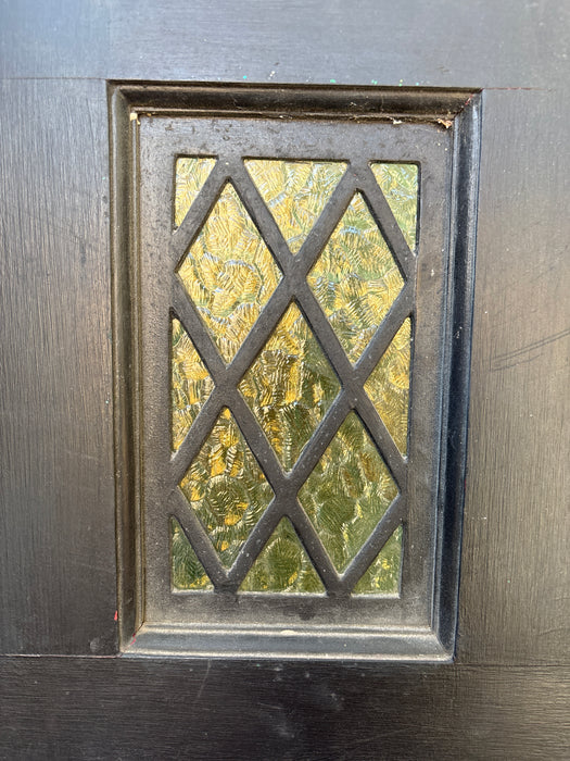 BLACK EXTERIOR DOOR WITH SMALL STAINED GLASS WINDOW