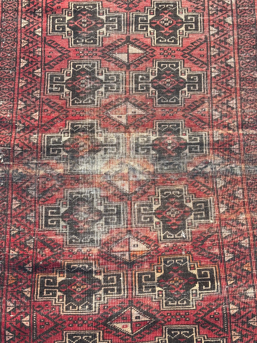 SMALL RED AND BLACK HAND TIED RUG - AS FOUND