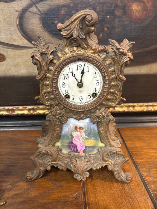 3 PIECE CHERUB PORTRAIT CLOCK SET WITH PAIR OF CANDELABRAS