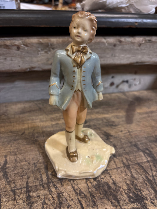CERAMIC BOY IN BLUE AND PINK STATUE ON BASE - AS FOUND