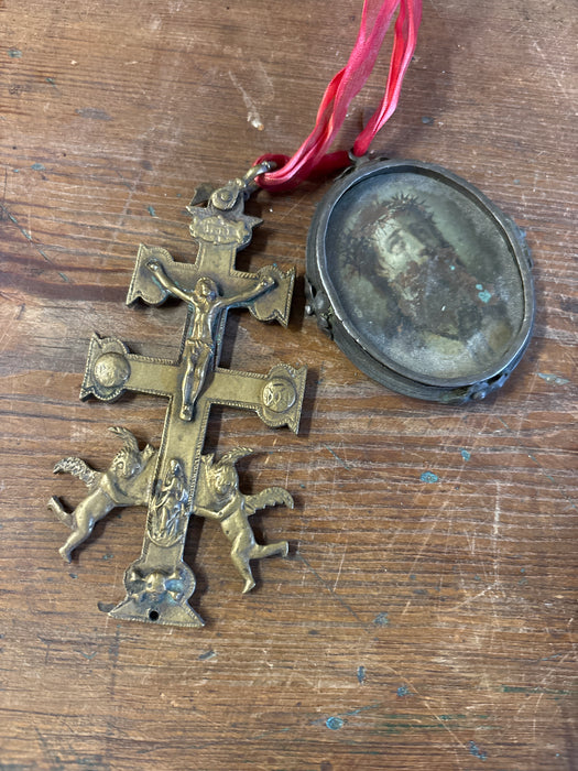 CRUCIFIX AND JESUS PENDANT ON RED RIBBON