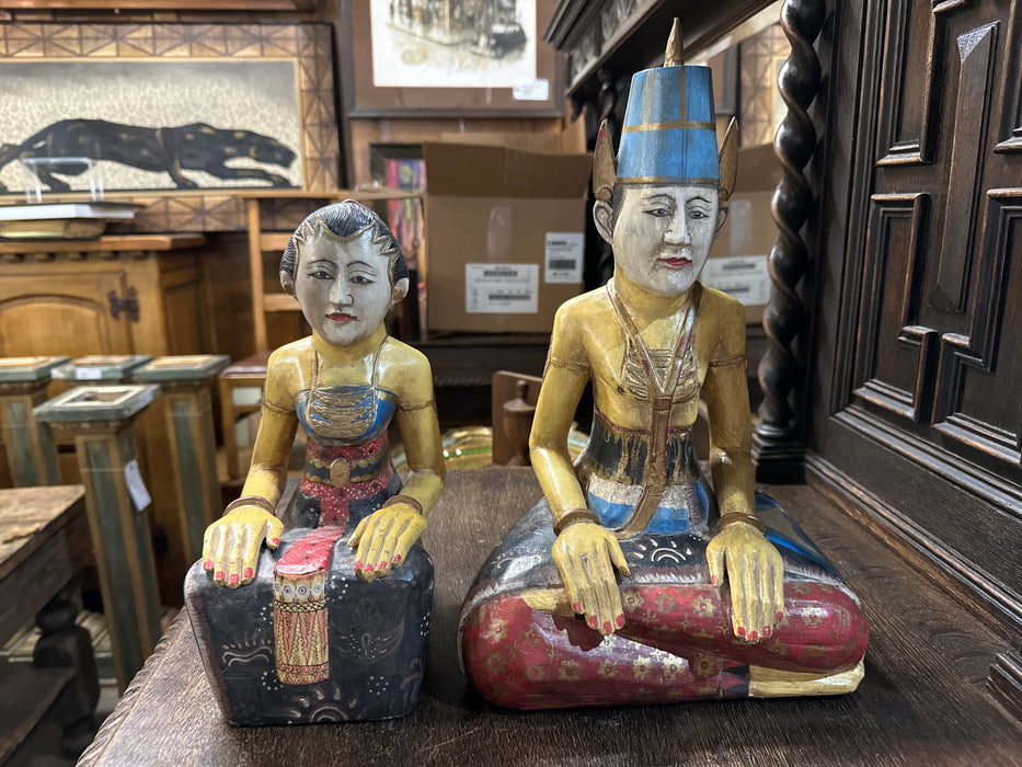 PAIR OF CARVED BANGLADESHI MAN AND WOMAN SEATED FIGURES