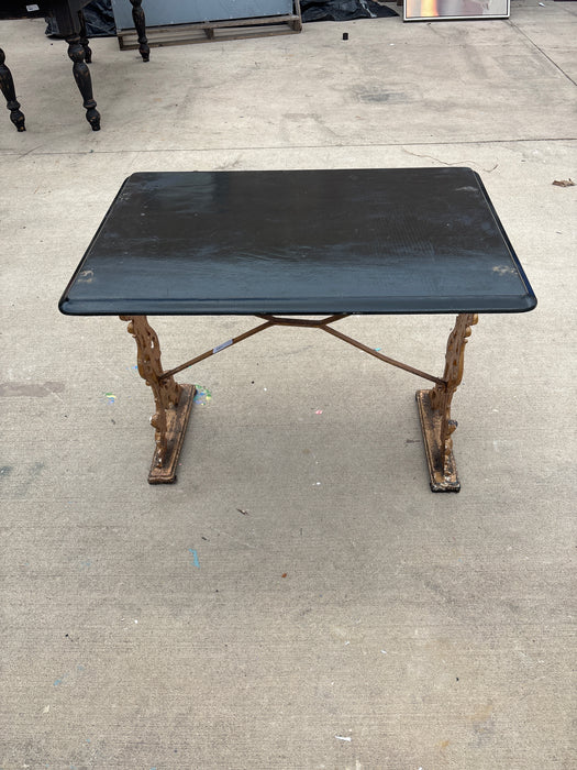 CAST IRON BISTRO TABLE WITH BLACK TOP 1 OF 2