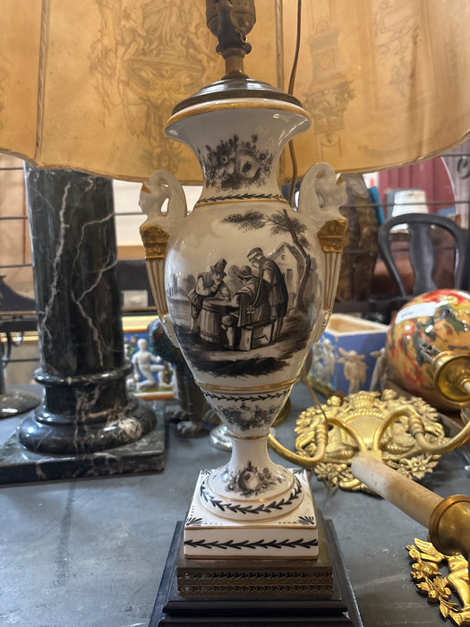 PAIR OF BLACK AND WHITE PORCELAIN URN SHAPED LAMPS WITH PEOPLE AND CLASSIC SYMBOL SHADES