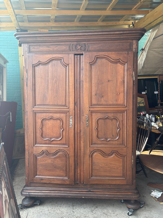 ANTIQUE LOUIS XV CARVED WALNUT ARMOIRE WITH BUN FEET