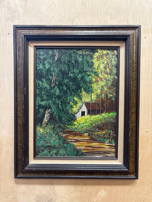 BROWN FRAMED ACRYLIC PAINTING OF BARN ALONG FOREST PATH WITH LINEN FILET - SIGNED THEDA SCROGGINS