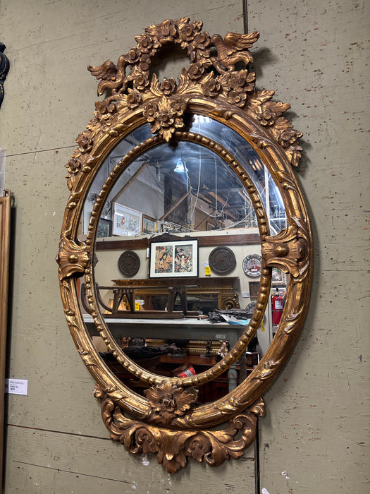 LARGE FRENCH 19TH CENTURY CARVED GILT WOOD OVAL MIRROR WITH BIRDS