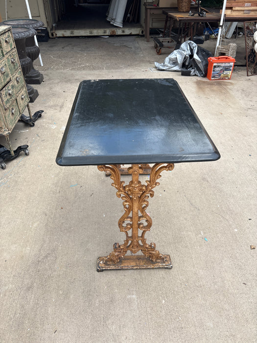 CAST IRON BISTRO TABLE WITH BLACK TOP 1 OF 2