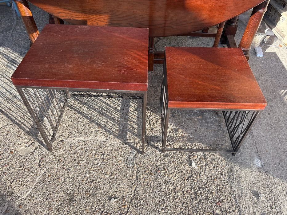 PAIR OF STACKING IRON AND WOOD NESTING TABLES