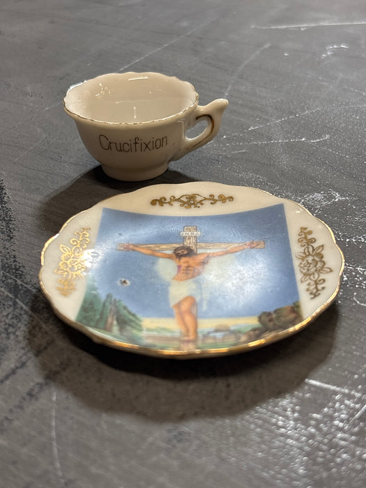CRUCIFIXION CUP AND SAUCER