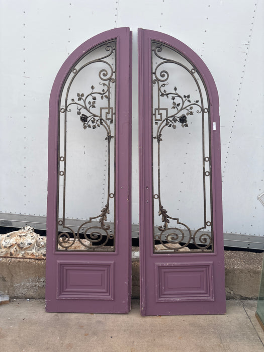 ARCHED PAIR OF PURPLE DOORS WITH FRENCH IRON ROSE PANELS