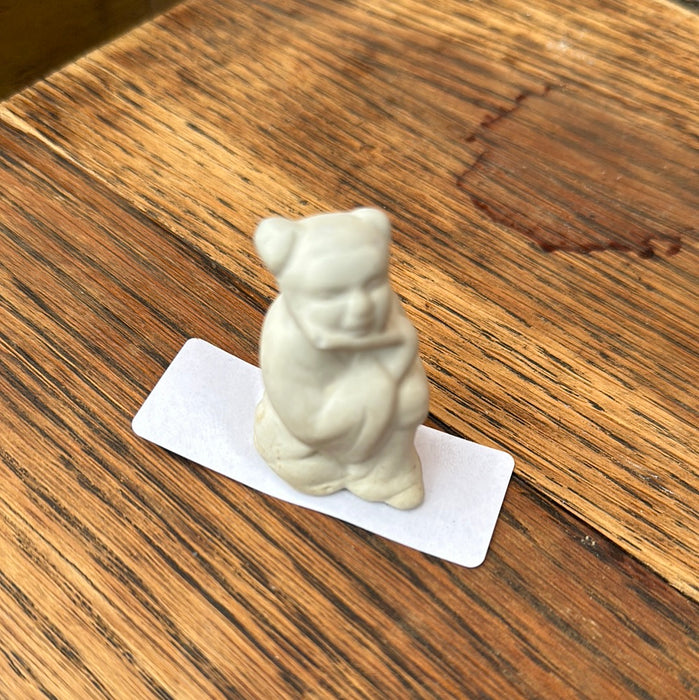 TINY BISQUE BUDDHA