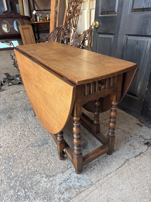 DROP LEAF OAK TABLE WITH DRAWER