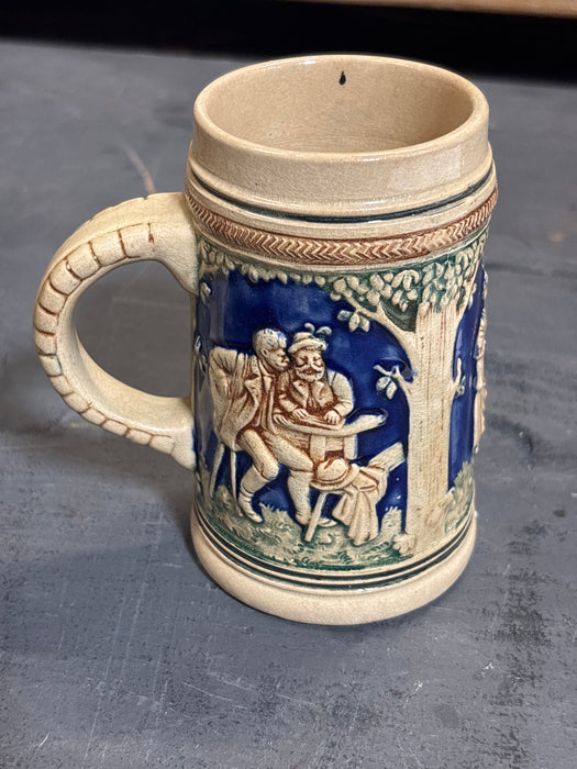 TINY BLUE AND GREEN BEER MUG WITH PEOPLE