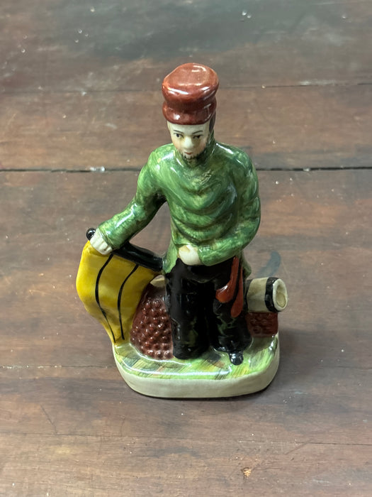 PORCELAIN STAFFORDSHIRE FIGURE OF MAN WITH GREEN JACKET