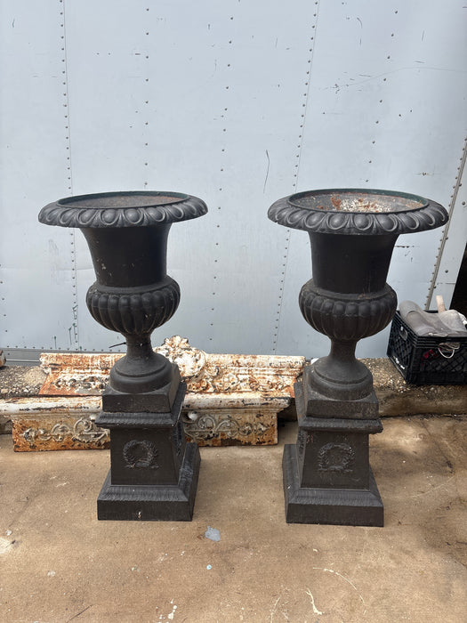 PAIR OF CAST IRON PLANTERS ON BASE