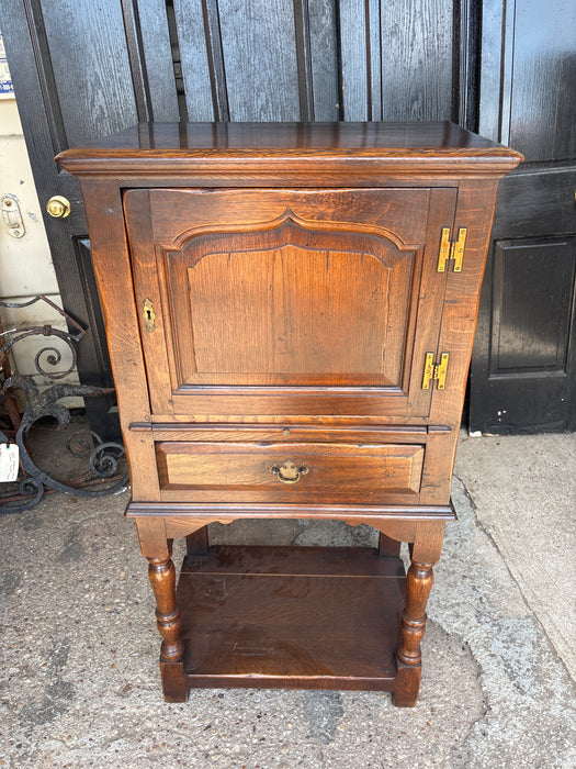 NARROW DARK OAK CABINET ON LEGS WITH PULL OUT