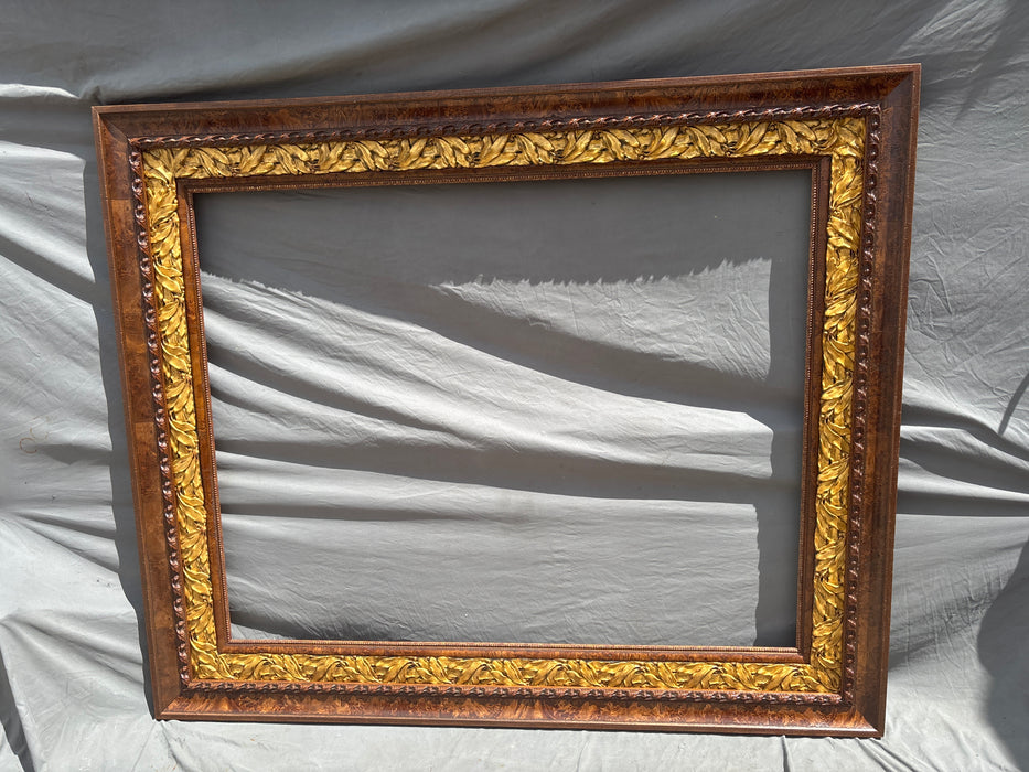 EXTRA LARGE BURLED AND CARVED WOOD FRAME WITH GOLD LEAVES
