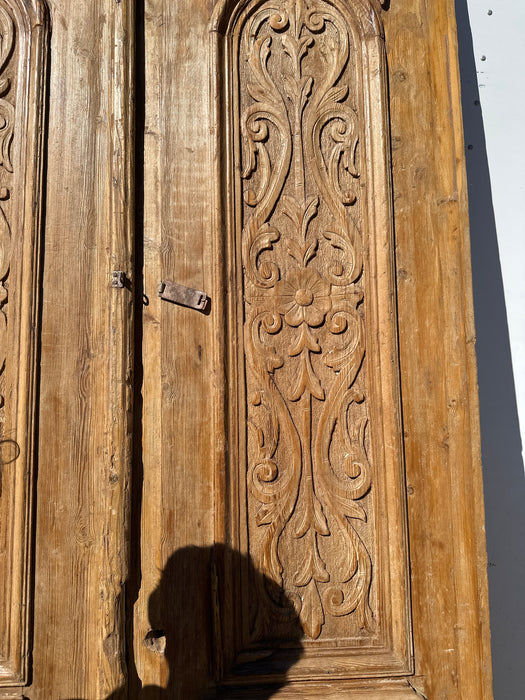 PAIR OF TALL FLORAL CARVED PINE DOORS