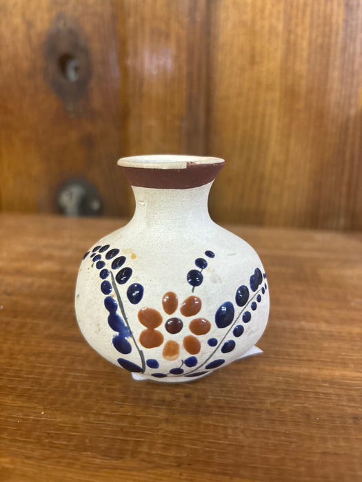 TINY BLUE AND WHITE VASE WITH ORANGE FLOWER